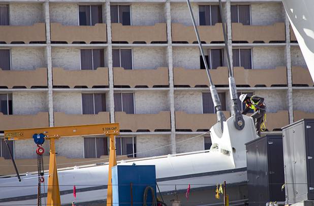 A construction worker is shown on the 550-foot tall High Roller, the world's tallest observation wheel, near the Las Vegas Strip and Flamingo Road Thursday, Nov. 7, 2013. The wheel is the centerpiece of the Linq project, a $550 million outdoor retail, dining and entertainment district being developed by Caesars Entertainment Corp. The High Roller will feature 28 cabins that will each hold 40 passengers.