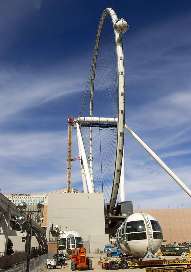 Cabins are shown attached to the 550-foot tall High Roller, the world's tallest observation wheel, under construction near the Las Vegas Strip and Flamingo Road Thursday, Nov. 7, 2013. The wheel is the centerpiece of the Linq project, a $550 million outdoor retail, dining and entertainment district being developed by Caesars Entertainment Corp. The High Roller will feature 28 cabins that will each hold 40 passengers.