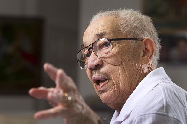 World War II veteran Harvey Johnson, 90, talks about his service during during an interview at his home Sunday, Nov. 10, 2013. Johnson served in a hospital unit in Papua New Guinea and in the Philippines, he said.