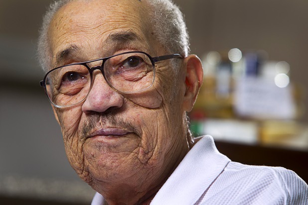 World War II veteran Harvey Johnson, 90, talks about his service during during an interview at his home Sunday, Nov. 10, 2013. Johnson served in a hospital unit in Papua New Guinea and in the Philippines, he said.