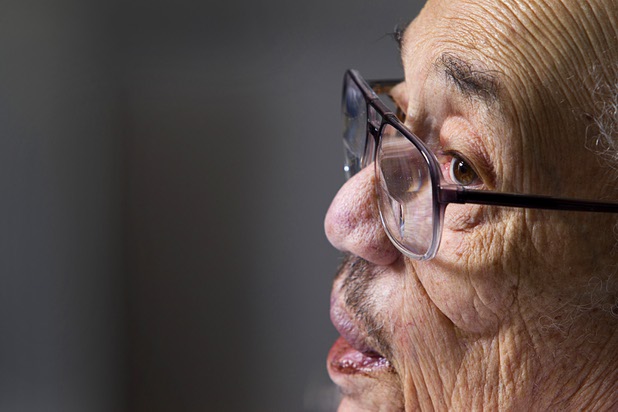 World War II veteran Harvey Johnson, 90, talks about his service during during an interview at his home Sunday, Nov. 10, 2013. Johnson served in a hospital unit in Papua New Guinea and in the Philippines, he said.