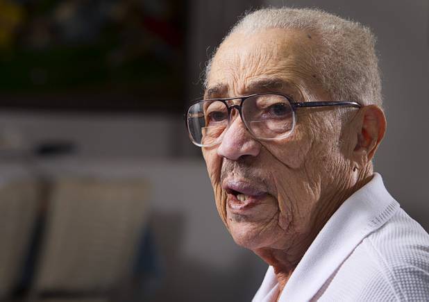 World War II veteran Harvey Johnson, 90, talks about his service during during an interview at his home Sunday, Nov. 10, 2013. Johnson served in a hospital unit in Papua New Guinea and in the Philippines, he said.