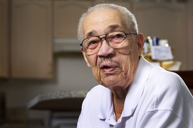 World War II veteran Harvey Johnson, 90, talks about his service during during an interview at his home Sunday, Nov. 10, 2013. Johnson served in a hospital unit in Papua New Guinea and in the Philippines, he said.