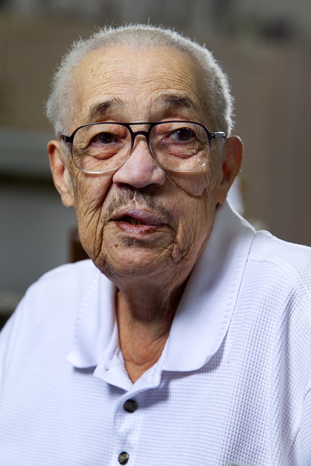 World War II veteran Harvey Johnson, 90, talks about his service during during an interview at his home Sunday, Nov. 10, 2013. Johnson served in a hospital unit in Papua New Guinea and in the Philippines, he said.