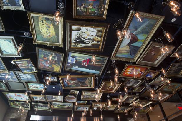Replicas of famous paintings cover the ceiling of the Art Bar in the Downtown Grand Monday, Nov. 11, 2013.