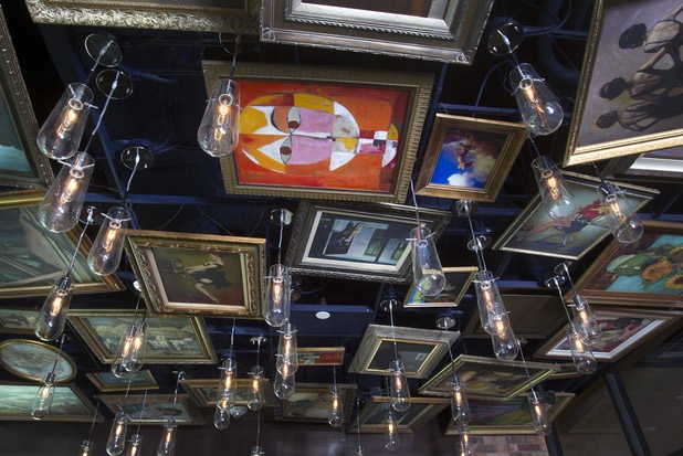 Replicas of famous paintings cover the ceiling of the Art Bar in the Downtown Grand Monday, Nov. 11, 2013.