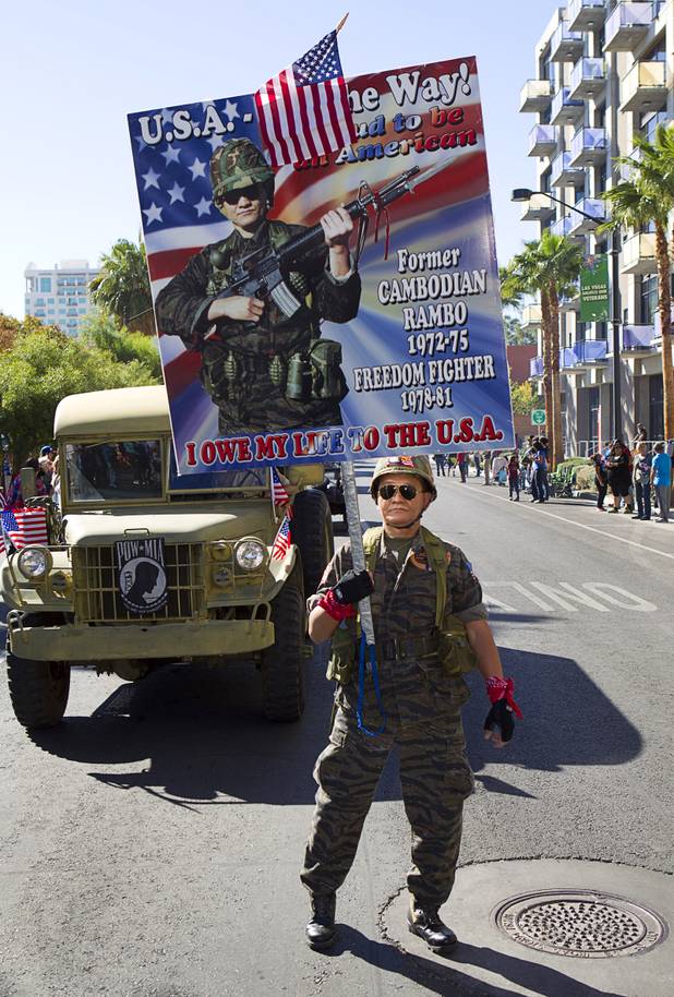 Sothy Seang, owner of the Donut Hut, marches in the Veterans Day parade in downtown Las Vegas Monday, Nov. 11, 2013. Seang fought with the Cambodian army against the Viet Cong during the Vietnam War.
