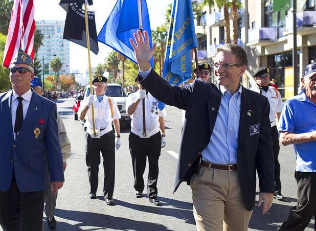 Congressman Joe Heck (R-NV) waves during the annual Veterans Day parade in downtown Las Vegas Monday, Nov. 11, 2013.