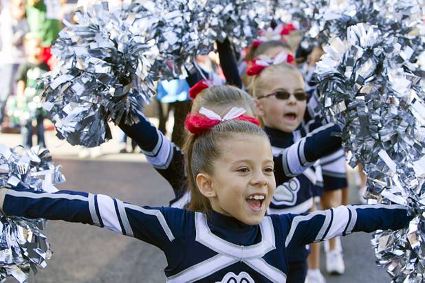 Members of the Ward Elementary School "Wigglin' Wolves" perform during the annual Veterans Day parade in downtown Las Vegas Monday, Nov. 11, 2013.
