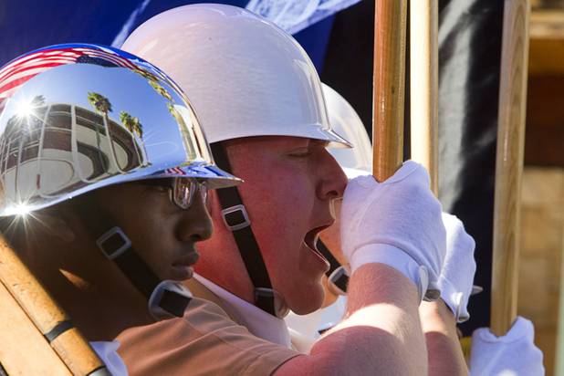 Members of a Centennial High School Navy junior R.O.T.C. honor guard march in the annual Veterans Day parade in downtown Las Vegas Monday, Nov. 11, 2013.