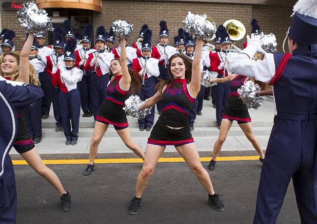 Valley High School cheerleaders perform with the school's marching band during an official opening ceremony for the Downtown Grand in downtown Las Vegas Tuesday, Nov. 12, 2013.