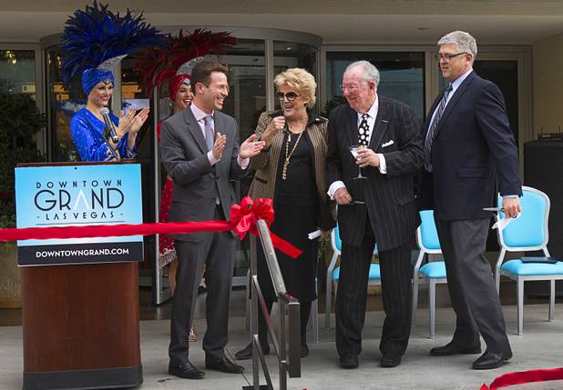 From left, Seth Schorr, CEO of the Downtown Grand, Las Vegas Mayor Carolyn Goodman, former Mayor Oscar Goodman and Bill Doak, first vice president at CIM Group, celebrate during an official opening ceremony for the Downtown Grand in downtown Las Vegas Tuesday, Nov. 12, 2013.