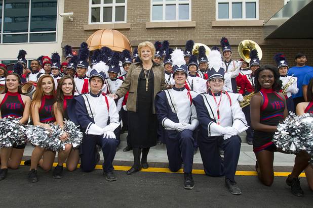 Las Vegas Mayor Carolyn Goodman poses with members of the Valley High school band and cheerleaders during an official opening ceremony for the Downtown Grand in downtown Las Vegas Tuesday, Nov. 12, 2013.