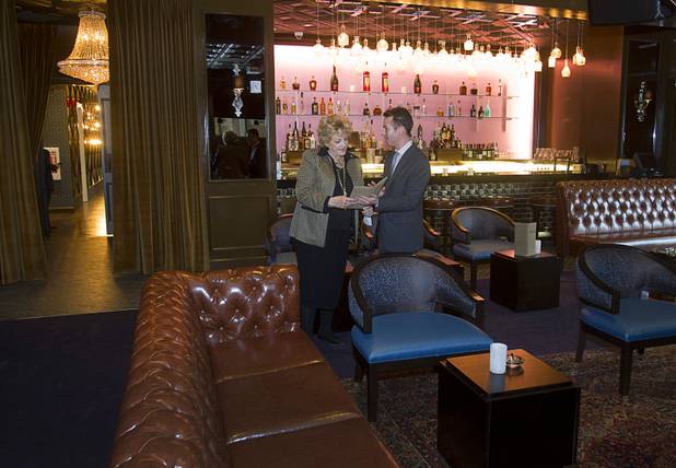 Las Vegas Mayor Carolyn Goodman and Seth Schorr, CEO of the Downtown Grand, look over a drink menu in the Mob Bar following an official opening ceremony for the Downtown Grand in downtown Las Vegas Tuesday, Nov. 12, 2013. 