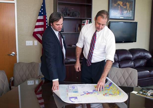 North Las Vegas Mayor John Lee and Ryann Juden, then intergovernmental affairs/chief of staff, look over a map in his office at North Las Vegas City Hall in this file photo taken Tuesday, Nov. 12, 2013.