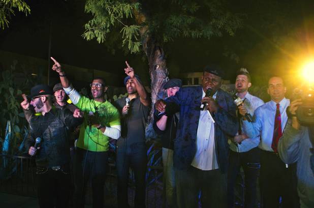 George Wallace, Michael Grimm and MO5AIC members gather on stage to help turn on the lights during the 20th anniversary of Ethel M's Cactus Lighting on Tuesday, Nov. 12, 2013.