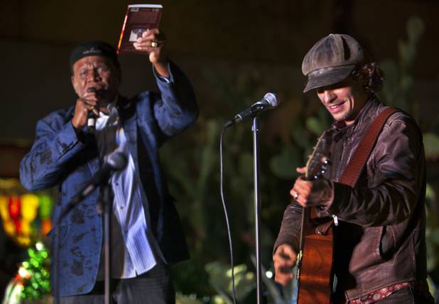 Comedian George Wallace, as host of the 20th anniversary of Ethel M’s Cactus Lighting, introduces musician Michael Grimm to perform a few holiday tunes on Tuesday, Nov. 12, 2013.