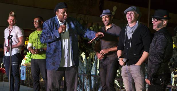 Comedian George Wallace, as host of the 20th anniversary of Ethel M's Cactus Lighting, introduces the musical group MO5AIC to perform a few holiday tunes on Tuesday, Nov. 12, 2013.