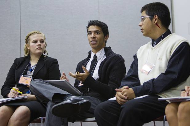 Austin Champion, center, of Legacy High School, makes a comment to a discussion during the annual Las Vegas Sun Youth Forum at the Las Vegas Convention Center Wednesday, Nov. 13, 2013. Listening are Kaylin Kolteryahn of Boulder City High School and Cristian Herrera of Desert Pines.