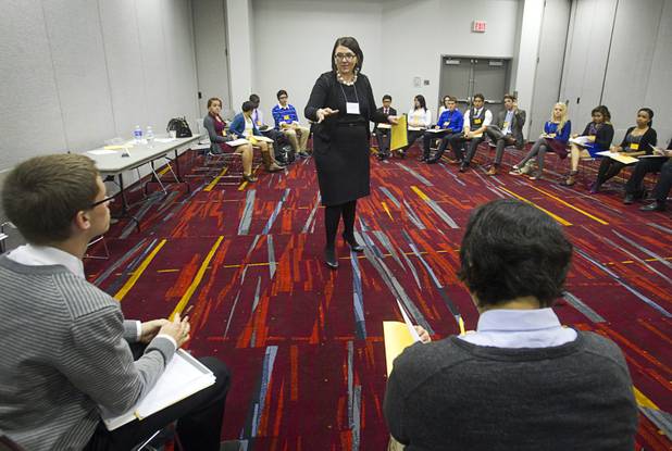 Alisa Nave-Worth, an attorney with Brownstein Hyatt Farber Schreck, moderates a discussion during the annual Las Vegas Sun Youth Forum at the Las Vegas Convention Center Wednesday, Nov. 13, 2013.