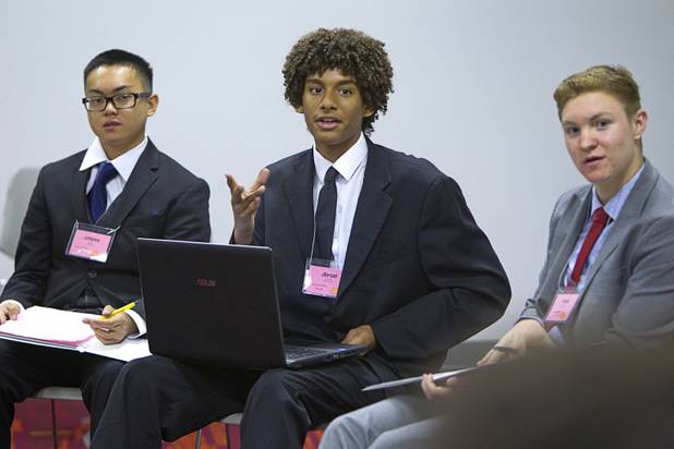 Jibrael Bushongo, center, of Arbor View, speaks during the annual Las Vegas Sun Youth Forum at the Las Vegas Convention Center Wednesday, Nov. 13, 2013. Listening are Johanns Estanol, left, of Liberty High School, and Daniel Maloney of Del Sol.
