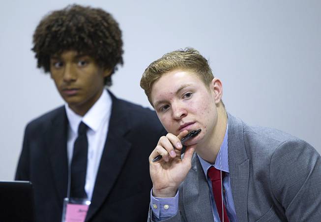 Jibrael Bushongo, left, of Arbor View High School, and Daniel Maloney of Del Sol, listen to a discussion during the annual Las Vegas Sun Youth Forum at the Las Vegas Convention Center Wednesday, Nov. 13, 2013.