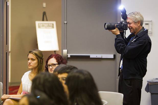 Darren Bush, a photographer with the Las Vegas News Bureau, takes a photo during the annual Las Vegas Sun Youth Forum at the Las Vegas Convention Center Wednesday, Nov. 13, 2013.