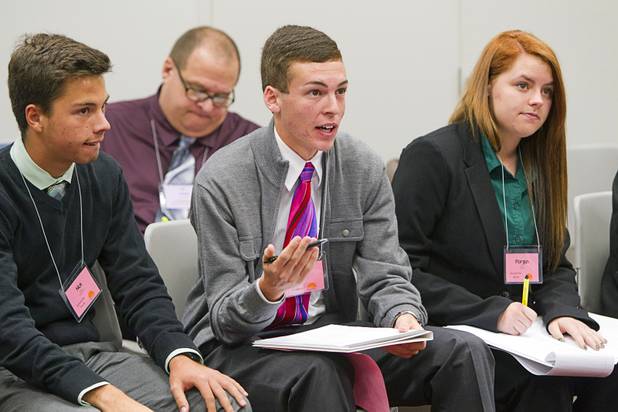 Colin Janison, center, of Palo Verde High School, outlines his group's position during the annual Las Vegas Sun Youth Forum at the Las Vegas Convention Center Wednesday, Nov. 13, 2013.