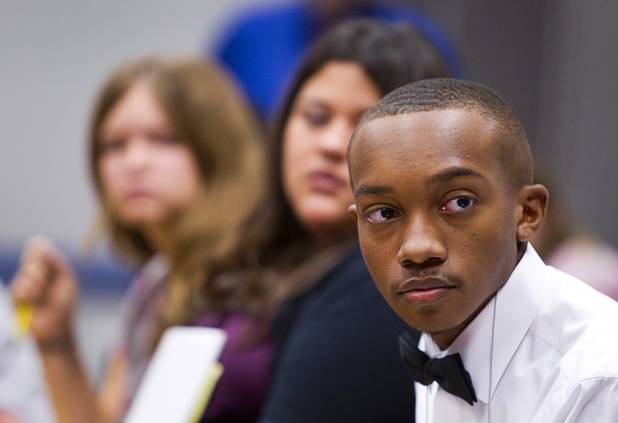 Jalen Jones, right, of Desert Pines High School, listens to a student discussion on international issues during the annual Las Vegas Sun Youth Forum at the Las Vegas Convention Center Wednesday, Nov. 13, 2013.