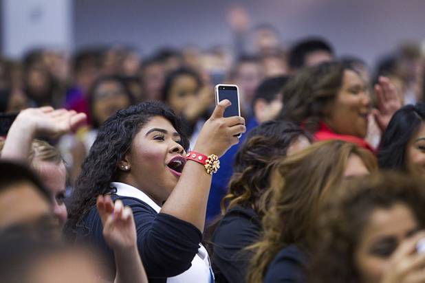 A student takes a video with her phone as Recysle Percussion performs during the annual Las Vegas Sun Youth Forum at the Las Vegas Convention Center Wednesday, Nov. 13, 2013.