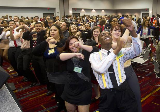 Students including Markquez Dotson, right, of Clark High School, dance during a lunch break at the annual Las Vegas Sun Youth Forum in the Las Vegas Convention Center Wednesday, Nov. 13, 2013.