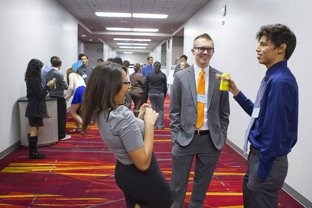 Brandi Giles, left of East Career and Technical Academy, Christian Orme, center, of Advanced Technologies Academy, and Luis Montanez, of Durango, chat in a hallway during a break at the annual Las Vegas Sun Youth Forum in the Las Vegas Convention Center Wednesday, Nov. 13, 2013.