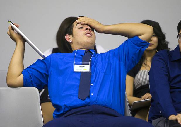 Ammir Azziz of Durango High School stretches as a discussion wraps up during the annual Las Vegas Sun Youth Forum at the Las Vegas Convention Center Wednesday, Nov. 13, 2013.