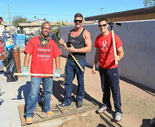 A volunteer, Nathan Minor of Chippendales at the Rio and the Quad headliner Jeff Civillico help landscape a North Las Vegas community park.
