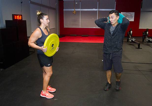 Trina Dorn takes a CrossFit class from trainer Boris Sapone at the Colosseum Training Center, in the Cashman Equipment complex on St. Rose Parkway, Thursday, Nov. 14, 2013.