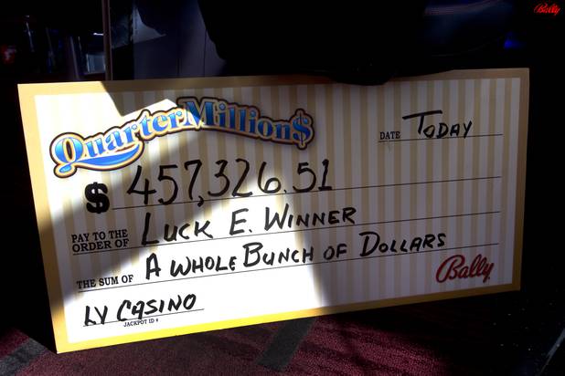 A mock-up, oversized check is shown at Bally Technologies Thursday, Nov. 14, 2013. A Jackpot Response Team member is always on call in the event that a gambler hits a progressive jackpot on a Bally Technologies slot machine.