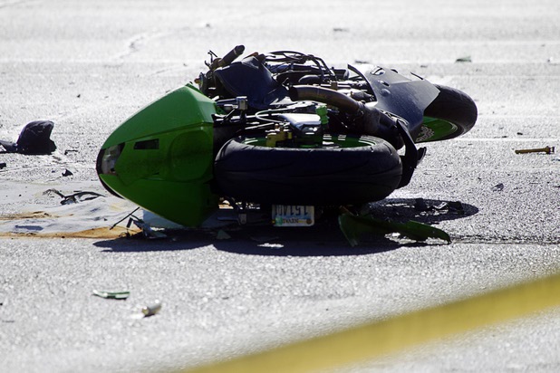 A motorcycle is shown at a fatal accident scene at the intersection of Flamingo and Lindell roads Thursday, Nov. 14, 2013.