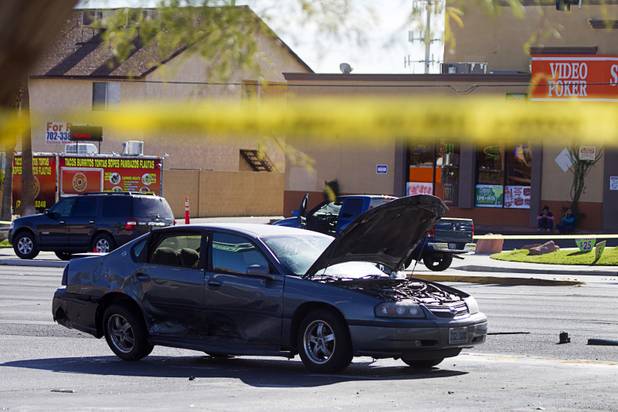 A vehicle is shown at the scene of a fatal motorcycle accident at the intersection of Flamingo and Lindell roads Thursday, Nov. 14, 2013.