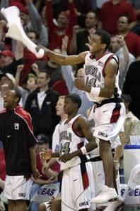 UNLV's Omari Pearson and the UNLV bench celebrate during their double overtime game against New Mexico at the Mountain West tournament in Las Vegas Thursday, March 7, 2002. UNLV defeated New Mexico 120-117. 