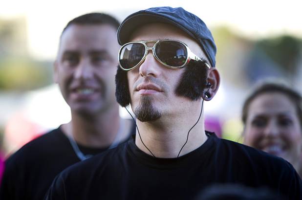 David Brunisholz, 36, of Switzerland, waits for a concert by All-American Rejects before the 5th annual Rock 'n' Roll Las Vegas Marathon Sunday, Nov. 17, 2013.