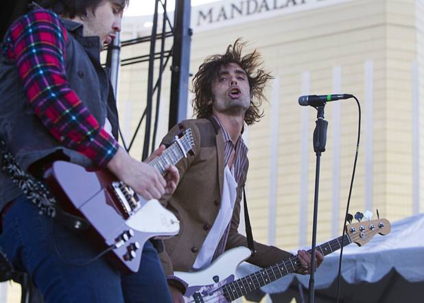 All-American Rejects lead singer Tyson Ritter, right, performs with the band during a concert before the 5th annual Rock 'n' Roll Las Vegas Marathon Sunday, Nov. 17, 2013.