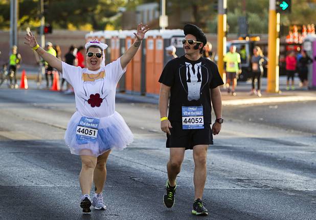 Marty and Eric Gilley of Las Vegas head out in the Zappos.com "1/2 of the Half" run during the 5th annual Rock 'n' Roll Las Vegas Marathon Sunday, Nov. 17, 2013.