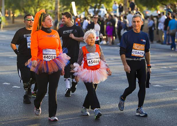 Mary Plant, 89, heads out for the Zappos.com "1/2 of the Half" run during the 5th annual Rock 'n' Roll Las Vegas Marathon Sunday, Nov. 17, 2013. With Plant are teammate Maurene Cullins and her son Mike Plant.