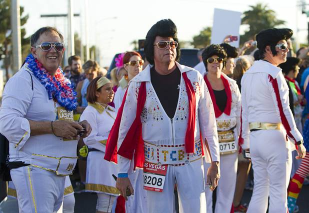 Runners dressed as Elvis wait for the start of the 5th annual Rock ’n’ Roll Las Vegas Marathon on Sunday, Nov. 17, 2013.