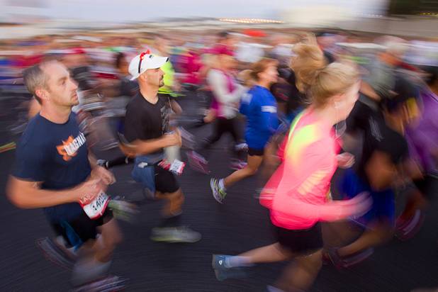 Half-marathon runners head out from the start line during the 5th annual Rock 'n' Roll Las Vegas Marathon Sunday, Nov. 17, 2013.