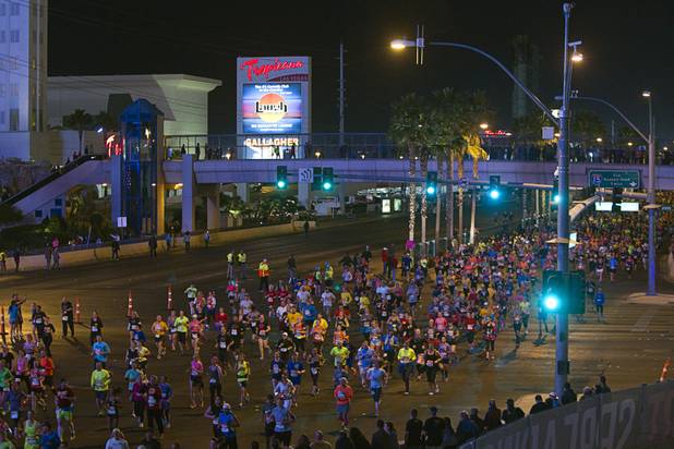 Half-marathon runners cross Tropicana Boulevard during the 5th annual Rock 'n' Roll Las Vegas Marathon Sunday, Nov. 17, 2013.