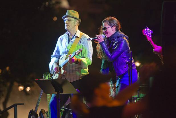 A band entertains runners as the pass Paris Las Vegas during the 5th annual Rock 'n' Roll Las Vegas Marathon Sunday, Nov. 17, 2013.