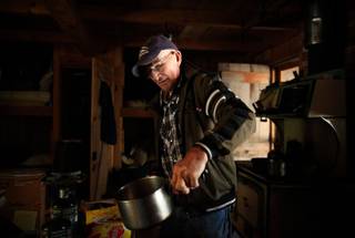 Jack English, 94, boils water for tea at his remote cabin in the Ventana Wilderness of California on Nov. 17, 2013.