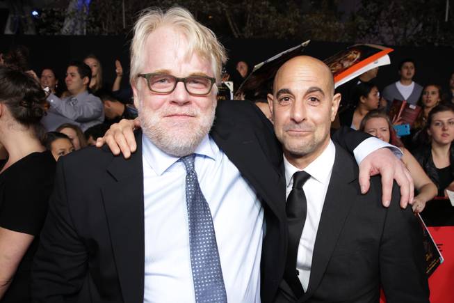 Philip Seymour Hoffman and Stanley Tucci seen at Lionsgate's 'The Hunger Games: Catching Fire' Los Angeles Premiere, on Monday, Nov, 18, 2013, in Los Angeles.