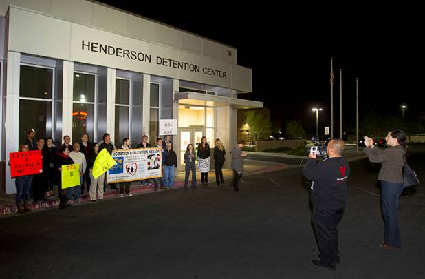 Protesters pose for a photo outside the Henderson Detention Center Tuesday, Nov. 19, 2013. The protesters are concerned about a UNLV law clinic report that raises questions about the conditions for immigrants at the detention center.